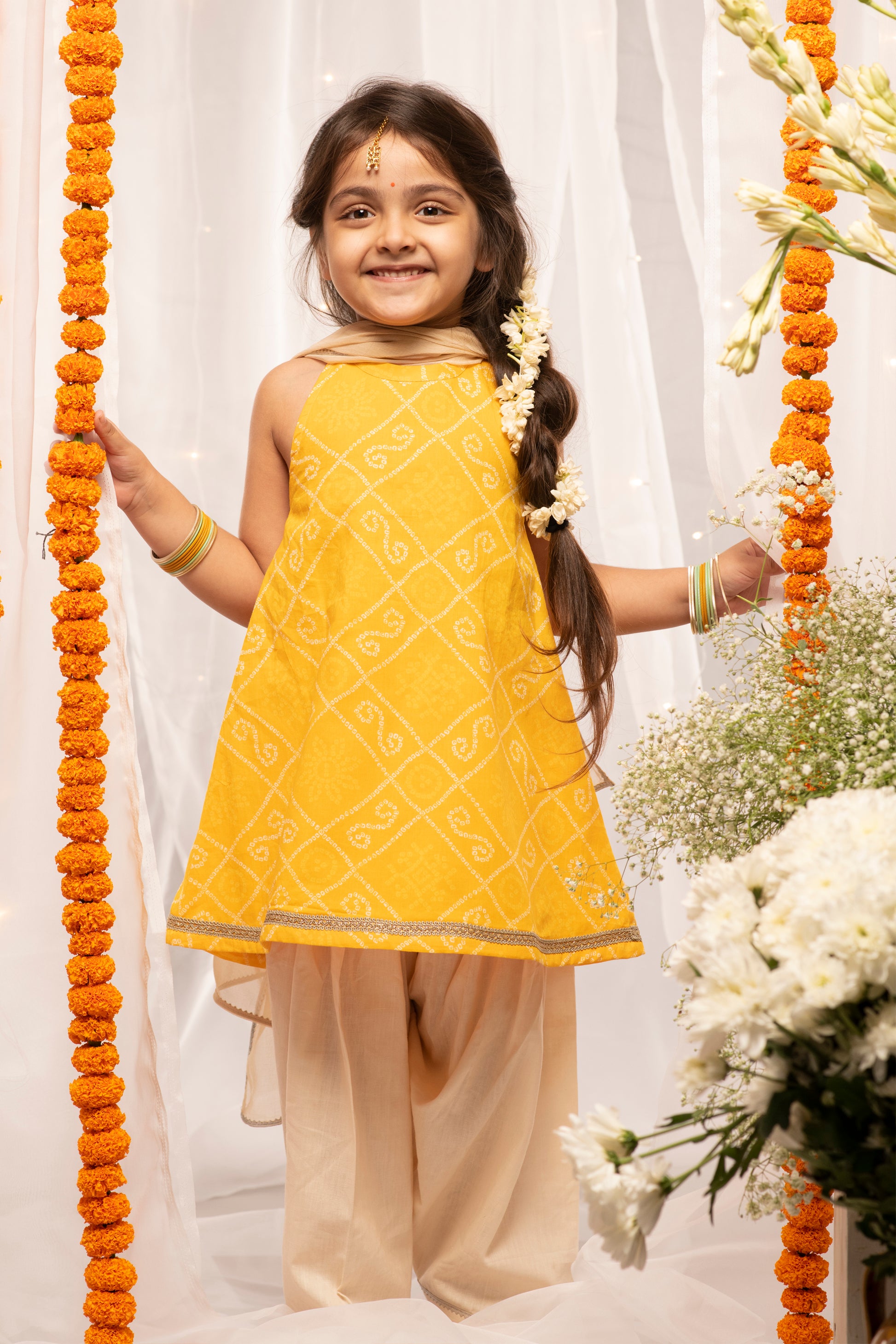 Buy Girls Yellow Printed Bandhani Suit Set by Tiber Taber Kids